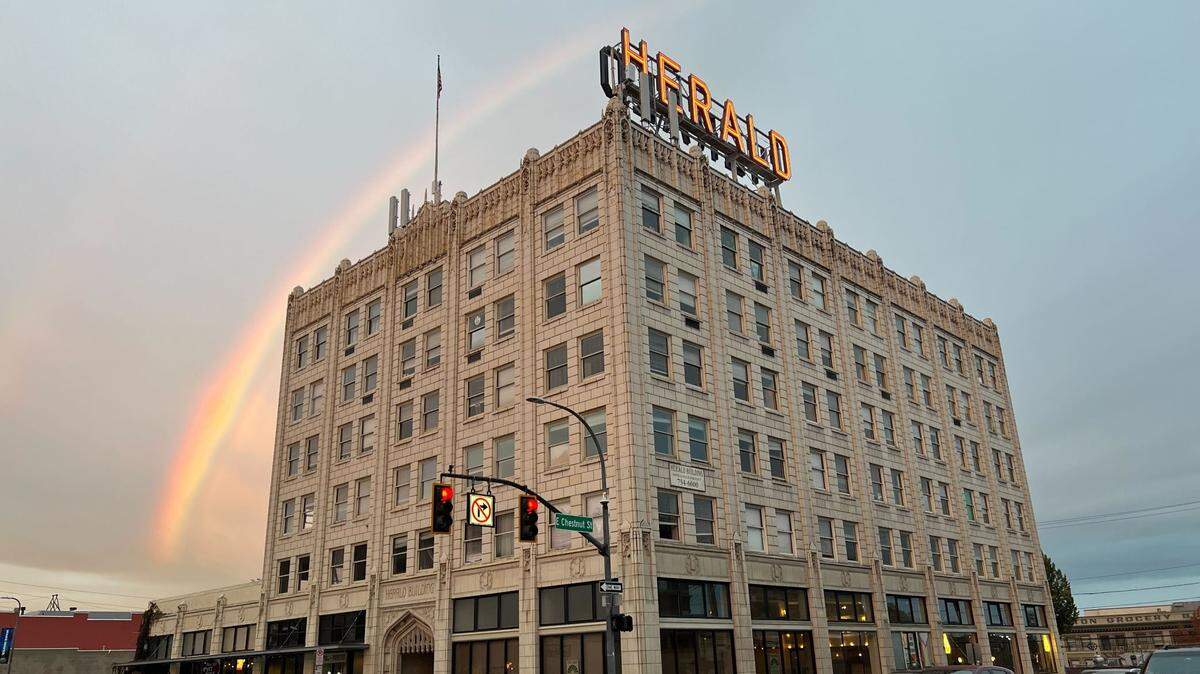 A rainbow arcs above the Herald Building at the corner of North State and East Chestnut streets in 2023.