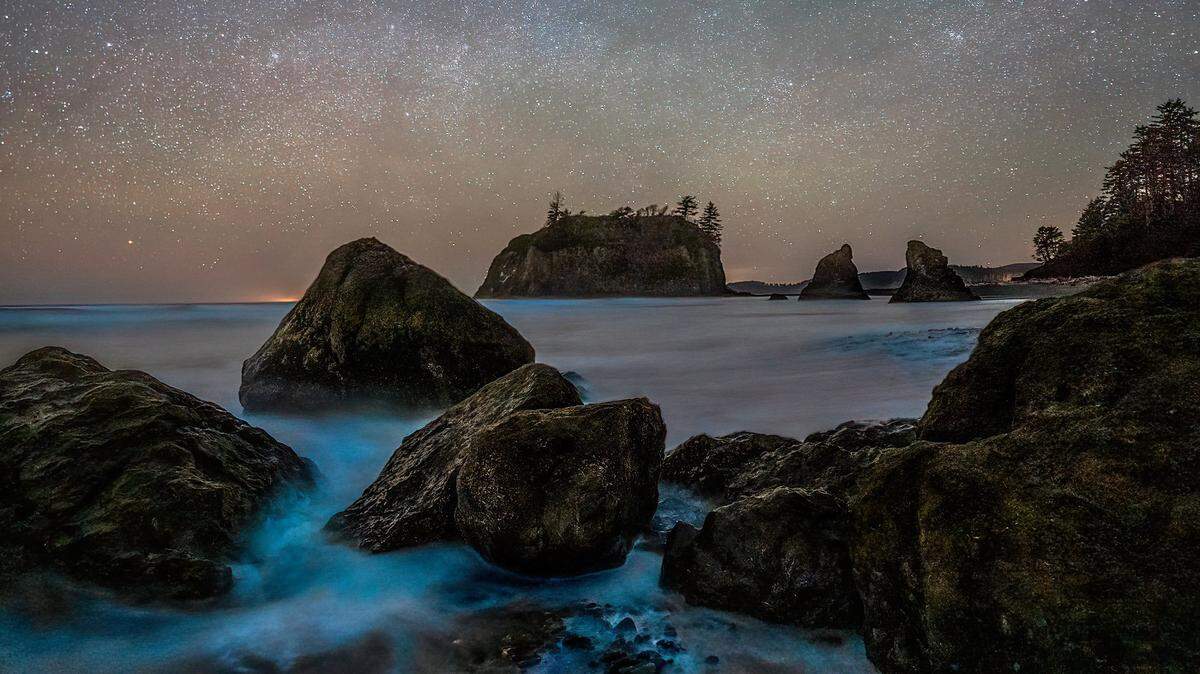 Waves stimulate bioluminescence from plankton at Ruby Beach in Jefferson County, Wash., on Friday, Feb. 25, 2022.