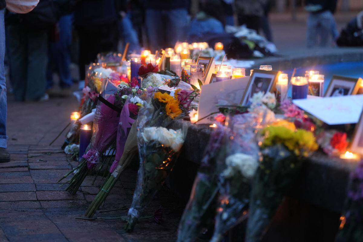 Flowers and candles displayed during a vigil Monday at Western Washington.