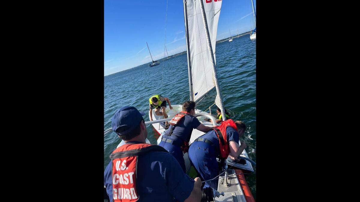 The U.S. Coast Guard team stationed in Bellingham responded to an overturned sailboat in Bellingham Bay on the weekend of July 22, 2023, to help flip the boat and assist the operators.
