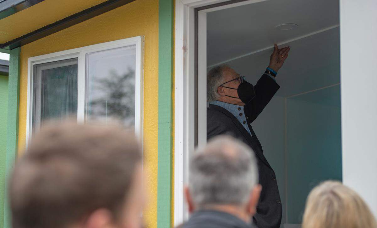 Washington state Gov. Jay Inslee inspects the inside of a tiny home at Gardenview Village on Tuesday, Oct. 12, in Bellingham.