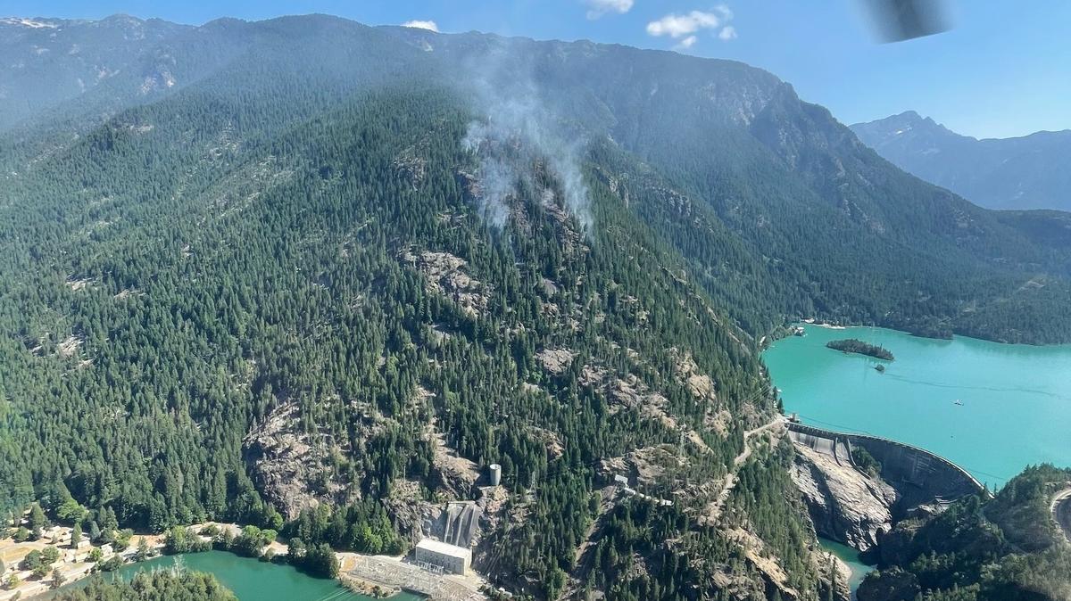 An aerial photo taken Monday shows where the fire is burning on Sourdough Mountain above the Skagit River and Diablo Dam.