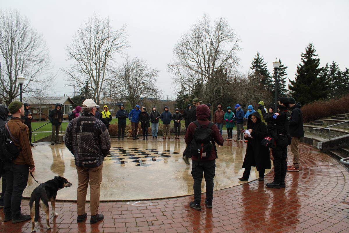 A group of people participate in chants for peace in the Interfaith Peace Walk on Feb. 21.