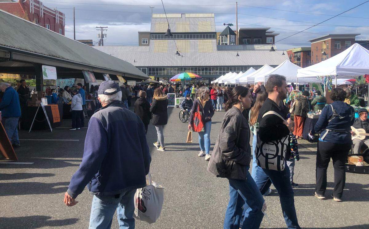 Shoppers check out the vendors at the Bellingham Farmers Market.