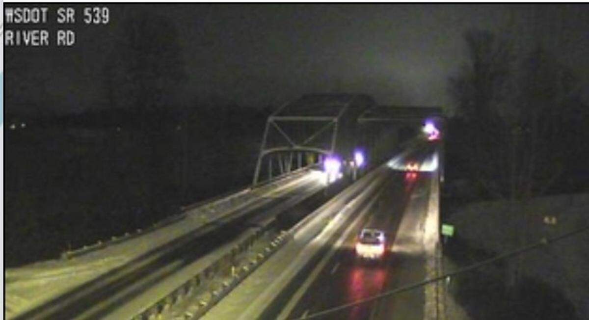 A traffic camera shows compact snow and ice on Guide Meridian at River Road south of Lynden, Wash., about 5:30 a.m. Tuesday, Feb. 4, 2025.