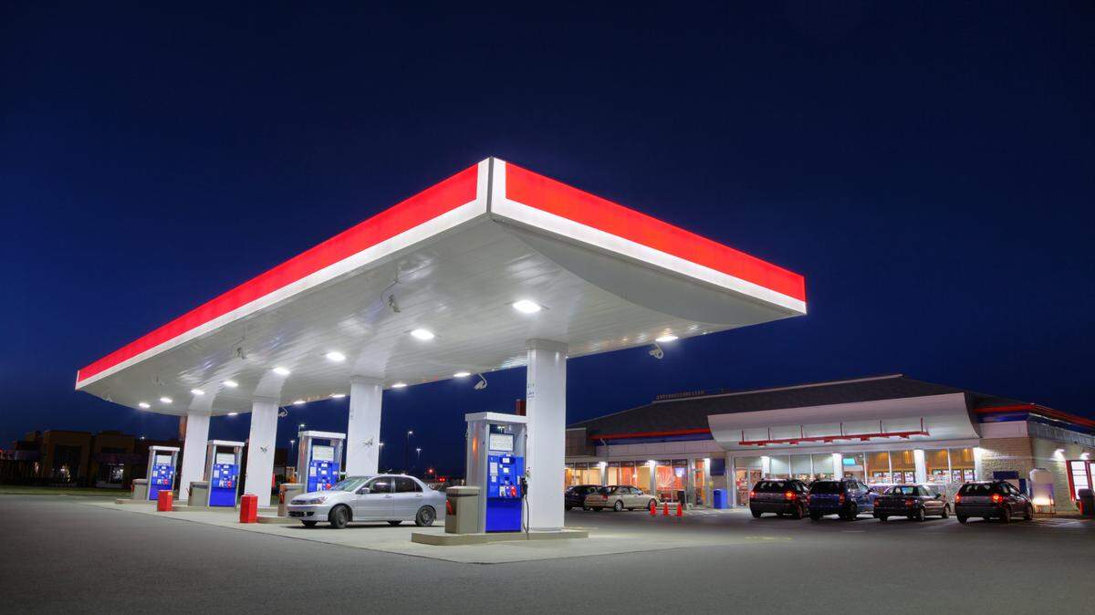 Stock photo of a gas station at night.