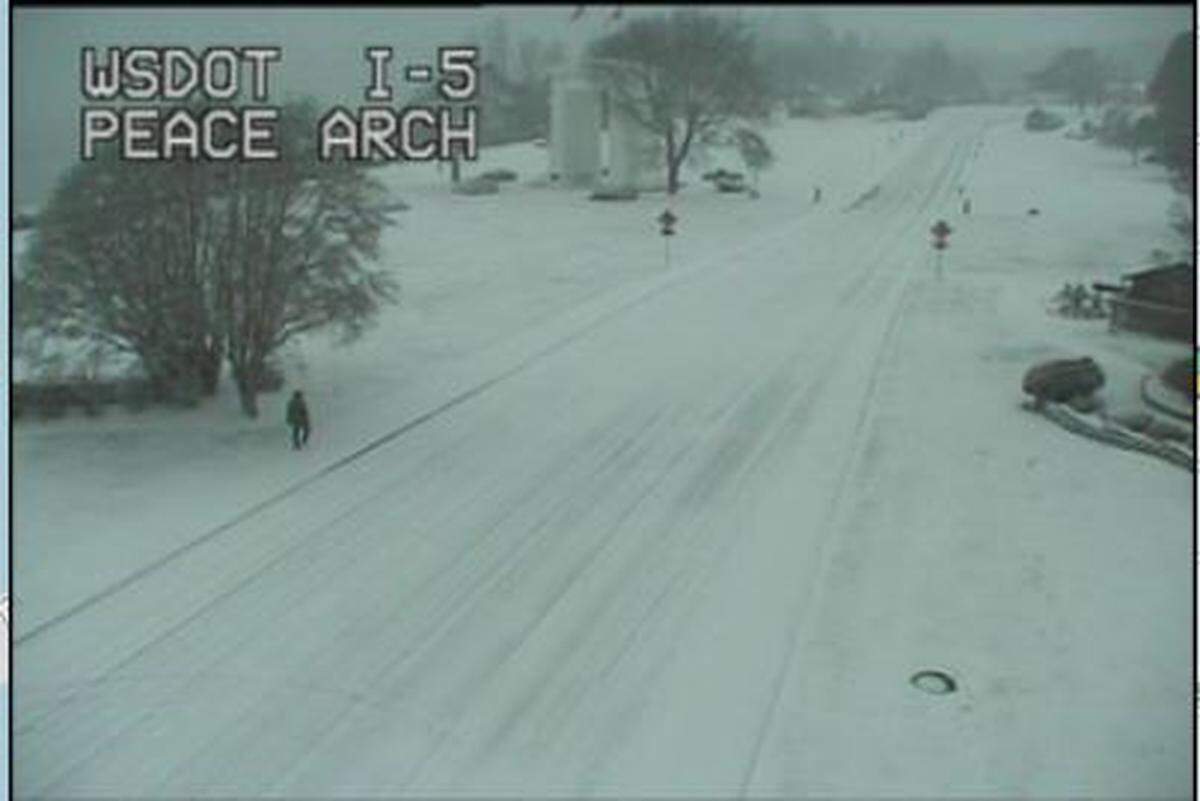 Light snow covers Interstate 5 at the Peace Arch at 8:10 a.m. Tuesday, Jan. 31, in Blaine.