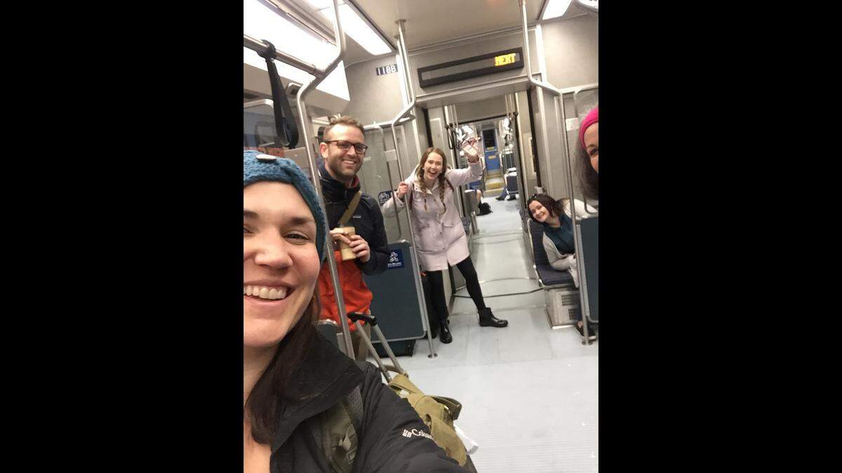 Patrice Parker, far right, and four new friends she made during a Feb. 3 trip to Bellingham ride the light rail in Seattle on their way to pick up a bus to Bellingham.