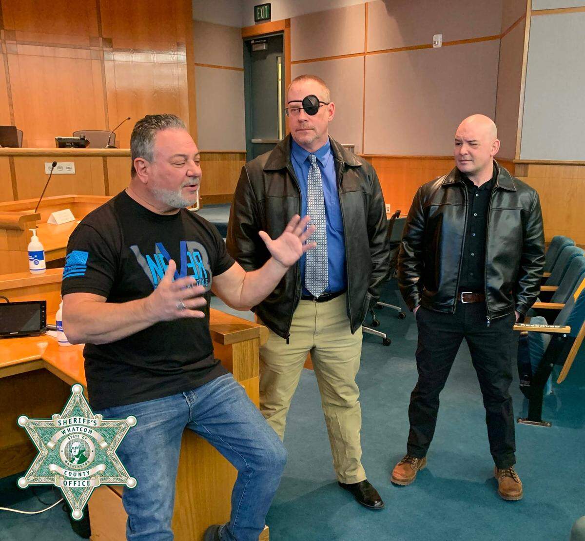 Randy Sutton from The Wounded Blue, left, visits with Whatcom County Sheriff’s Office deputies Jason Thompson, center, and Ryan Rathbun in a photo posted to Facebook on Friday, Feb. 25. Thompson and Rathbun suffered facial wounds from a 12-gauge shotgun blast as they responded to a neighbor dispute on Thursday, Feb. 11, near Maple Valley in Whatcom County.