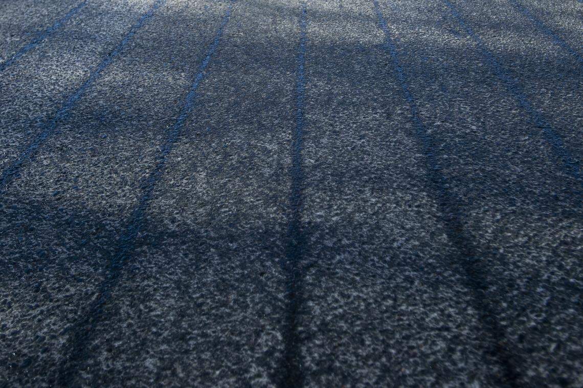 Stripes of de-icing agent sit on Fraser Street on Feb. 6, 2019. The de-icing agent lasts for 5-7 days.
