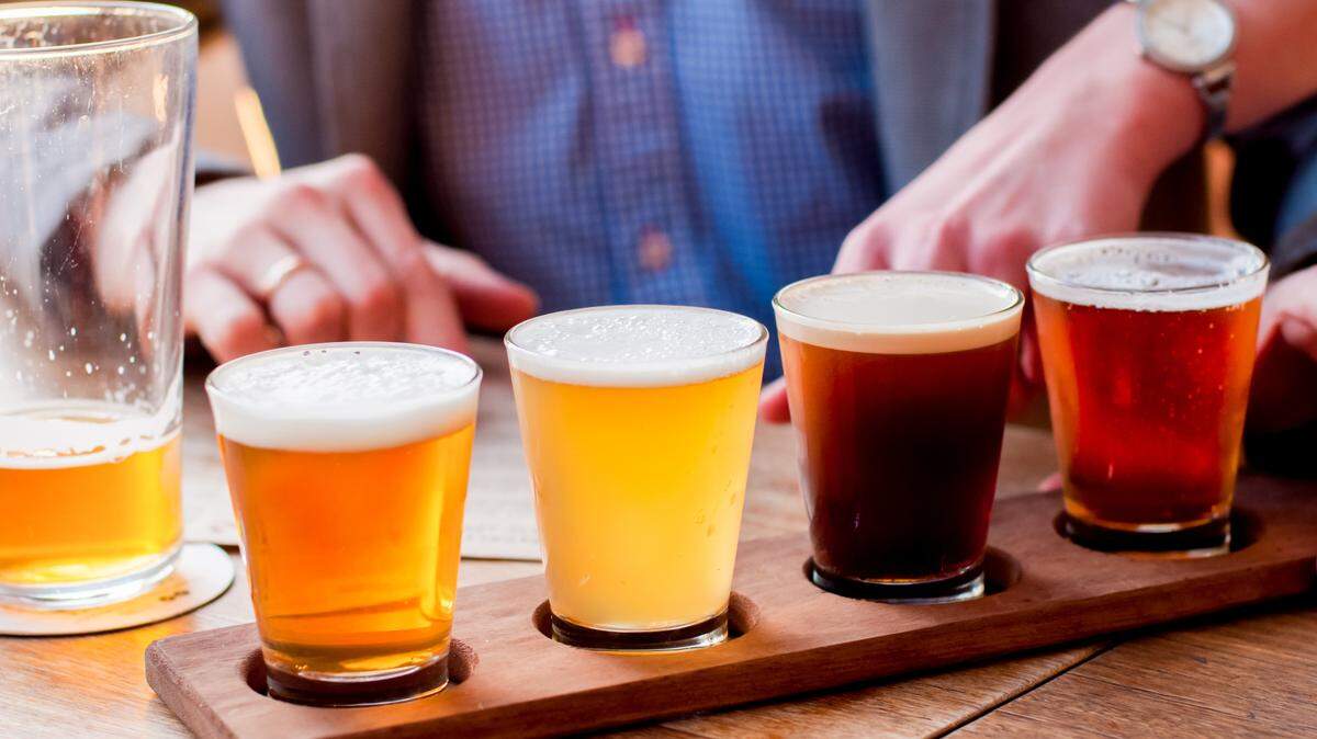 Selection of craft beers in a flight ready for tasting