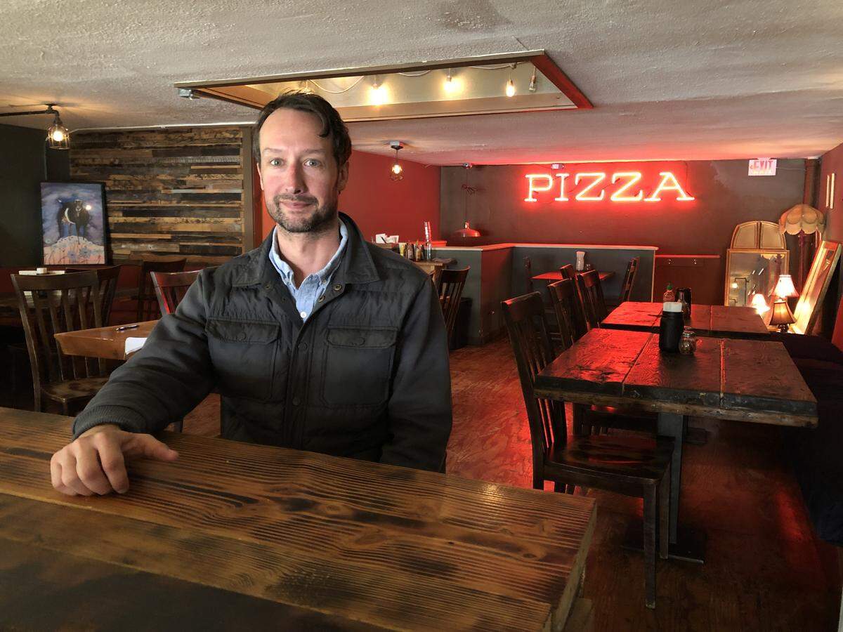 Charlie Pasquier, at Goat Mountain Pizza on Holly Street in downtown Bellingham, and Chas Kubis are closing the restaurant March 31, 2019. The business owners will move their nearby Black Sheep on Holly cocktail bar into the bigger space.