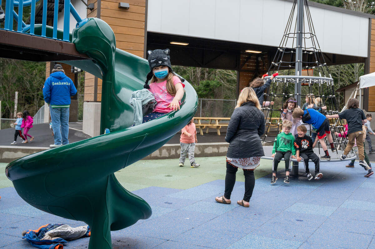 Children play on a recently constructed playground at Parkview Elementary School that includes features that encourage inclusivity on Monday, March 28, in Bellingham.