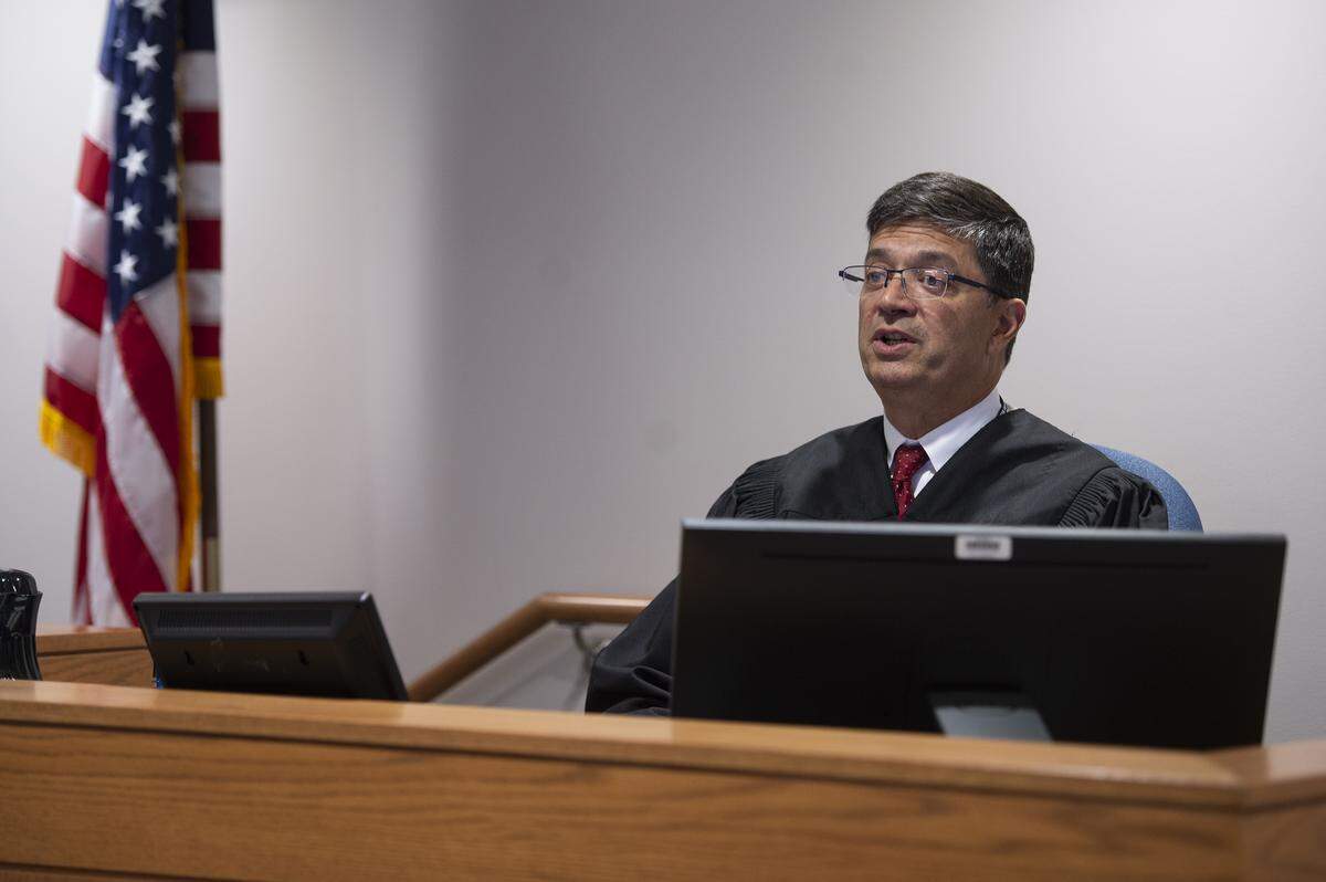 Whatcom County Court Commissioner Alfred Heydrich speaks to Whatcom County Prosecuting Attorney Eric Richey during the first appearance of Rigoberto Galvan in Whatcom County Superior Court Wednesday. Galvan faces charges of first-degree murder and burglary.