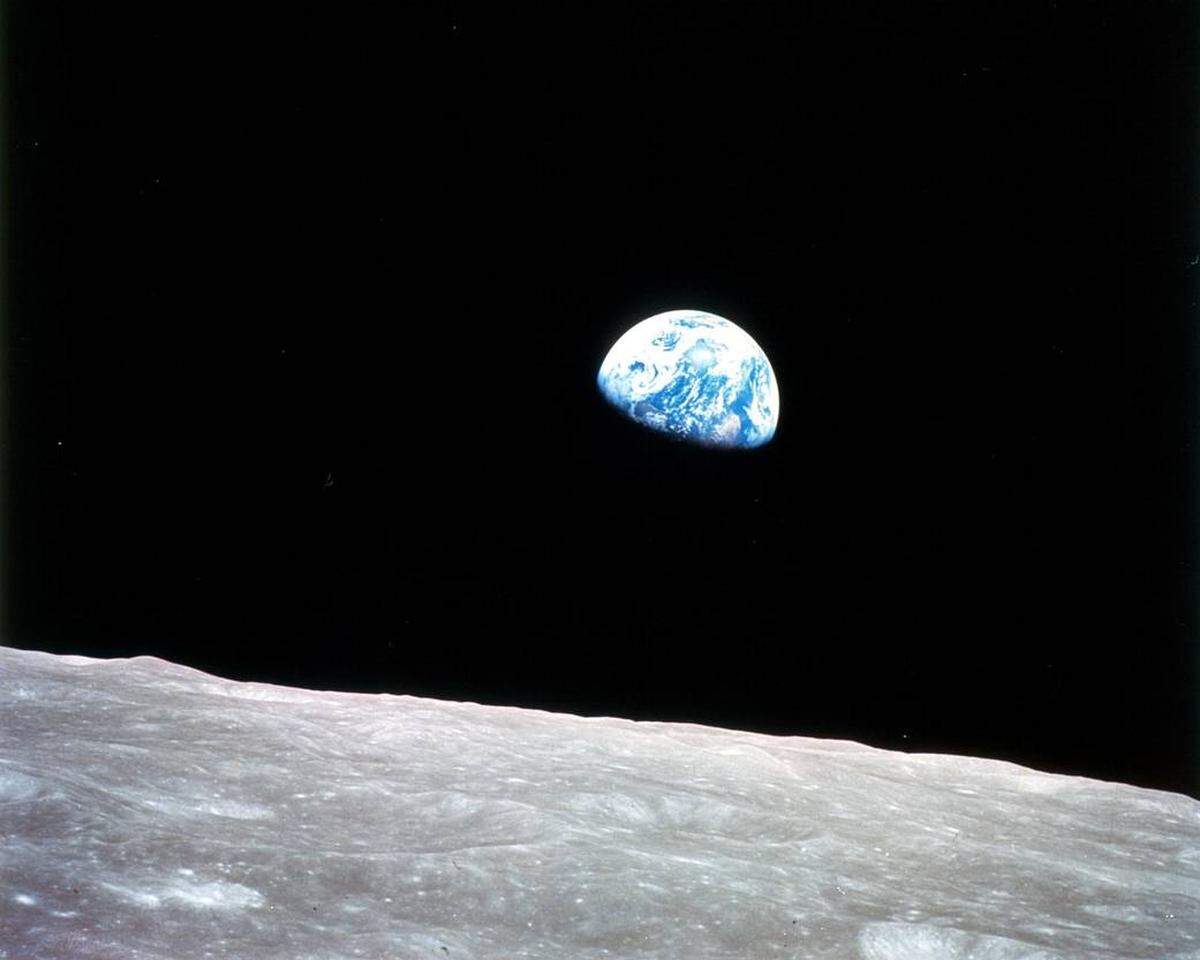 Earth rises above the lunar horizon as Apollo 8 completes an orbit of the moon on Dec. 24, 1968. Astronaut William A. Anders, an Air Force pilot with connections to Bellingham, snapped the photo that has become one of the most memorable images of all time.