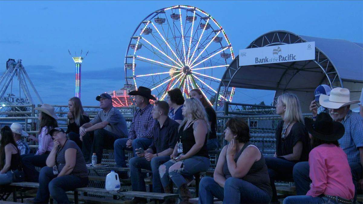 Spectators watch the first night of the rodeo at the Northwest Washington Fair in Lynden Tuesday night.