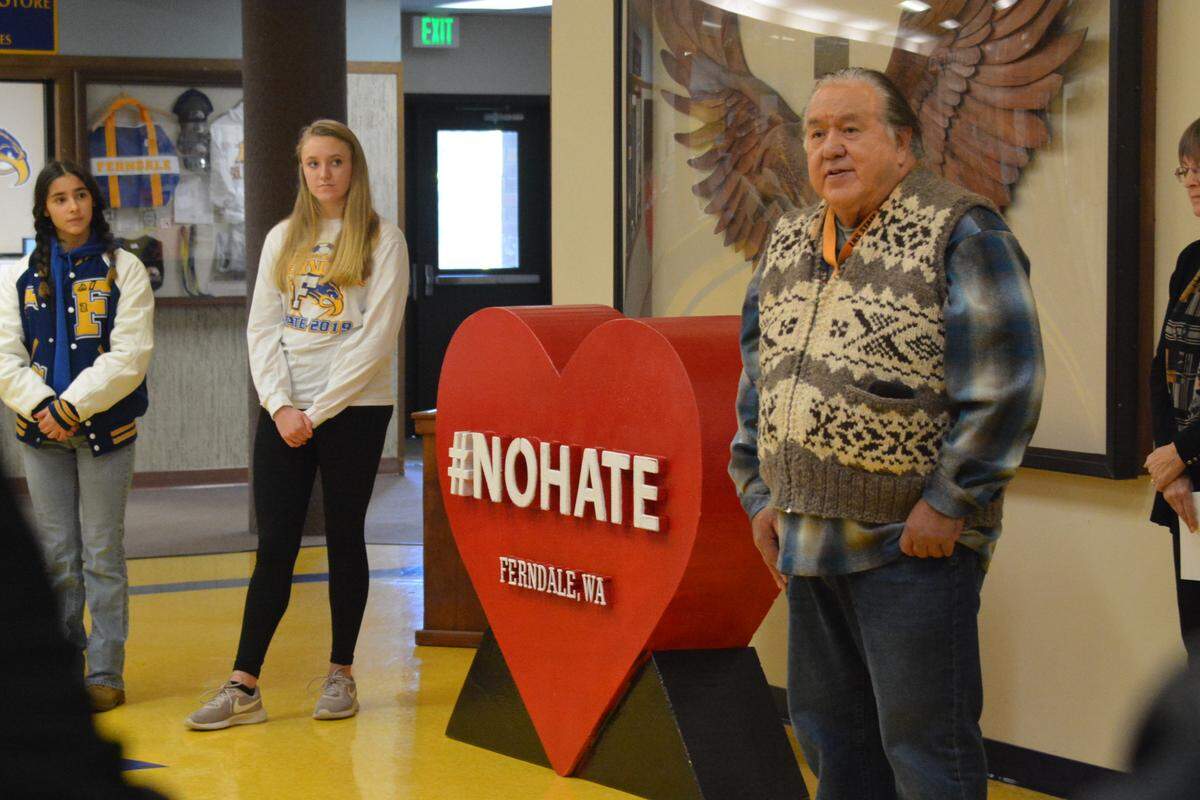 Hope Jose-Day, left, and Addi Ericksen watch as Bernie Thomas speaks on Nov. 25 at Ferndale High. Thomas is director of education at Lummi Nation School.