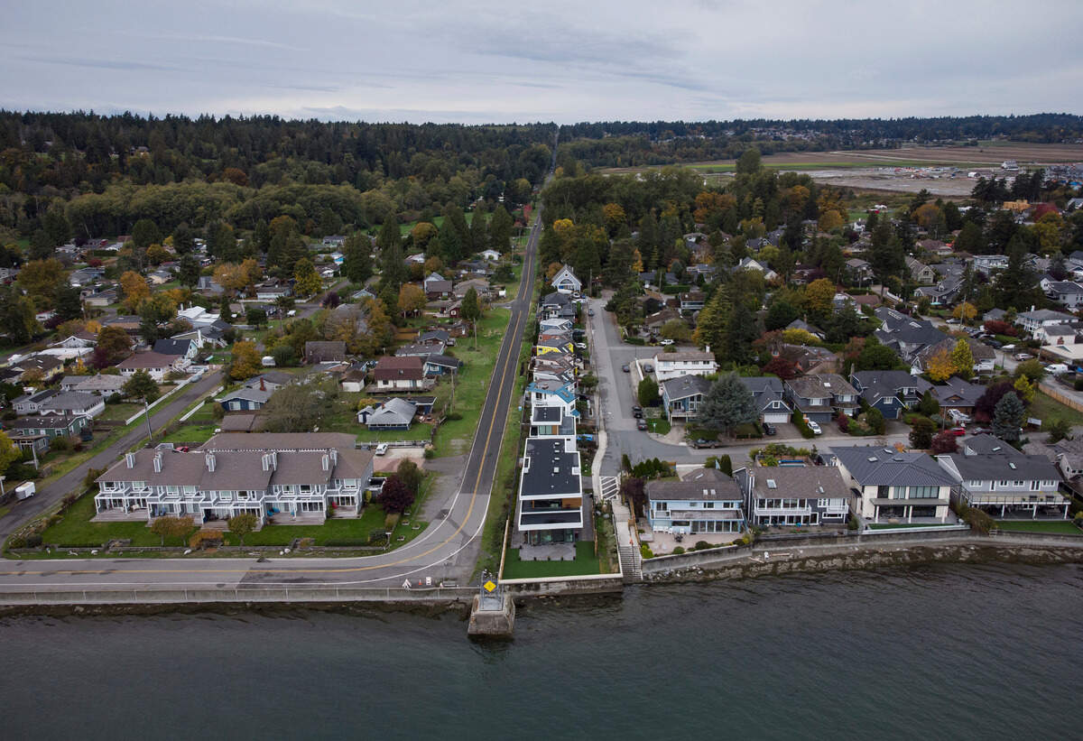 Homes in Delta, British Columbia (left) and Point Roberts, Wash. (right) are separated by the Canada-U.S. border that is just north of Roosevelt Way in Point Roberts.