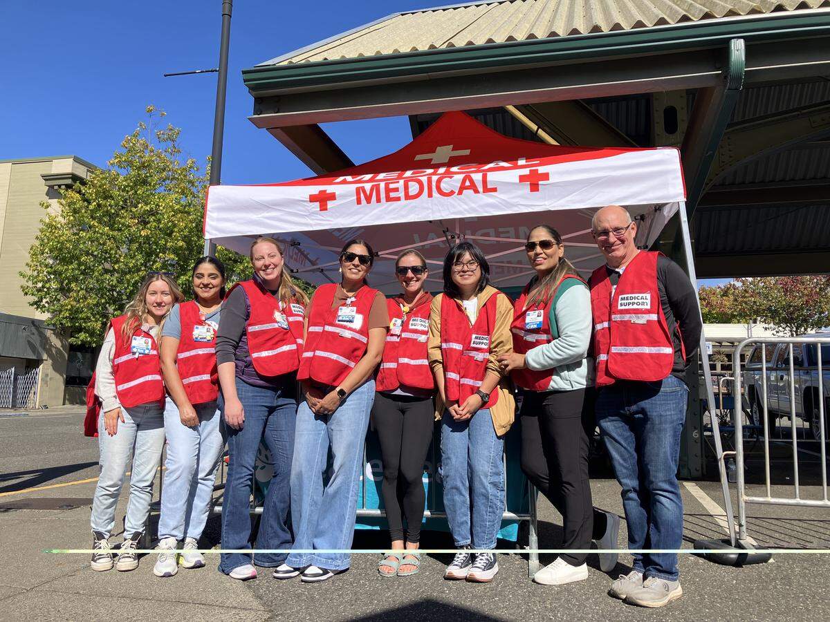 The volunteer medical team at the Bellingham Bay Marathon on Sept. 21, 2025. From left to right: Deana Belous, RN, 3rd Surgical, Aman Sandhu, RN, 3rd Surgical, Megan Frank, RN, 4 North; Manpreet Sandhu, RN, ED; Niki Clark, RN, Pediatrics; Ren Fellores. MA, Neurology; Rajdeep Bahga, RN, ED; Rob Rush, MD.