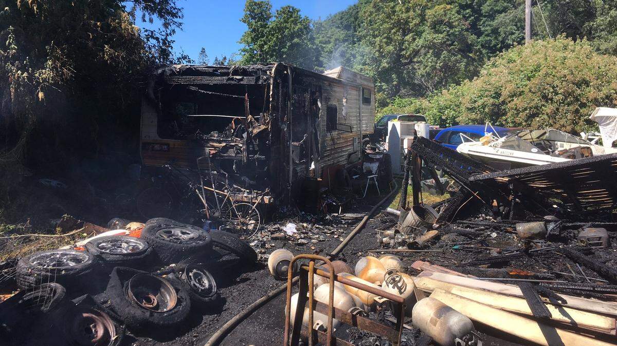 One outbuilding and three RVs were destroyed by a fire at 3408 Lena Road Monday afternoon.