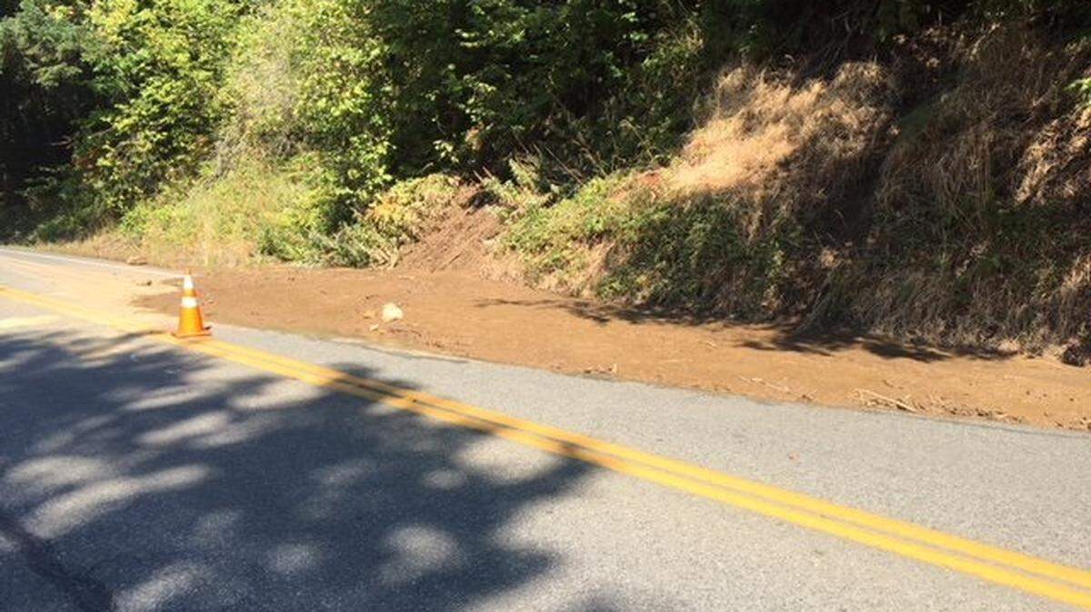 An unexpected mudslide closed one lane of Chuckanut Drive near Teddy Bear Cove Wednesday, Sept. 5. The slide also closed the Interurban Trail south of Bellingham while crews remove the debris.