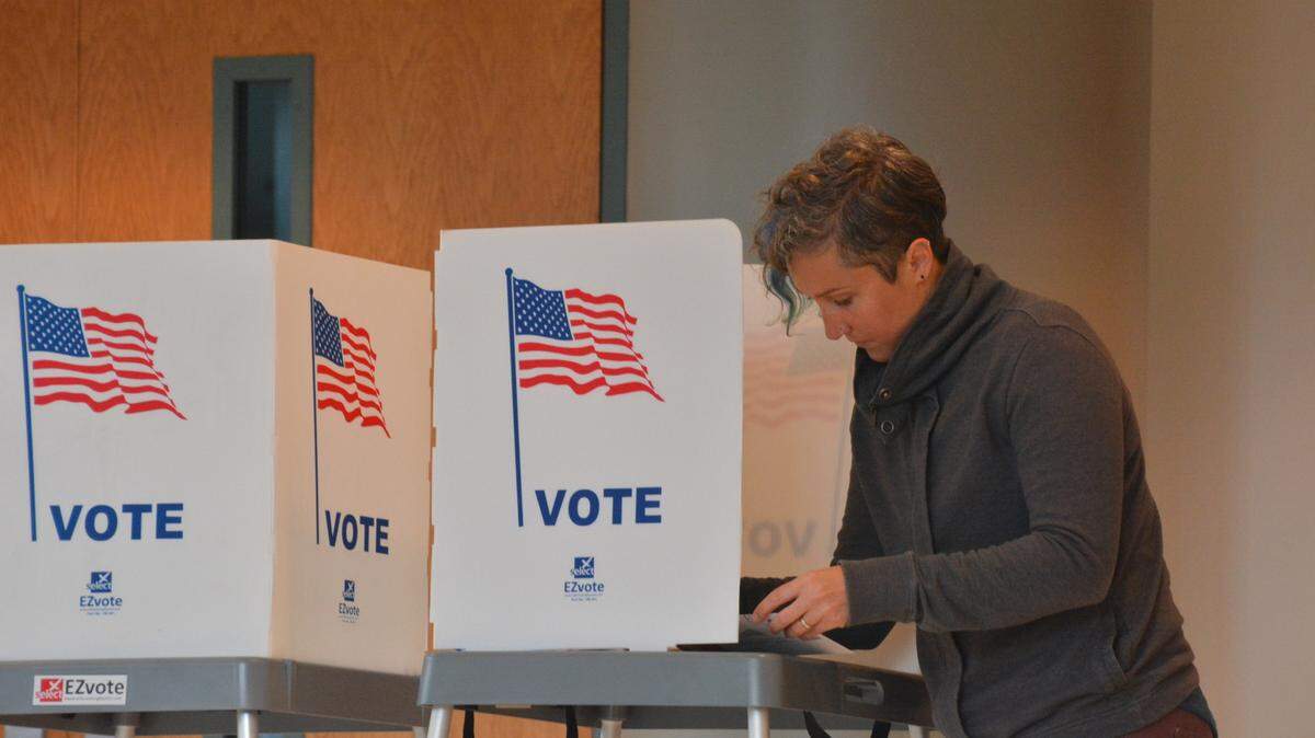 Lara Togoan of Bellingham fills out her ballot on Election Day at the Whatcom County Courthouse in Bellingham, Wash., on Nov. 7, 2023.