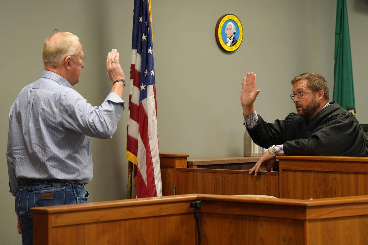 Whatcom County Superior Court Judge Evan Jones swears in Ron DeBoer on the first day of Joel Young’s attempted first-degree murder trial on September 11, 2024. DeBoer owned the house next door to Young’s and provided testimony of his first-hand experience on the day of the alleged crime in 2022.
