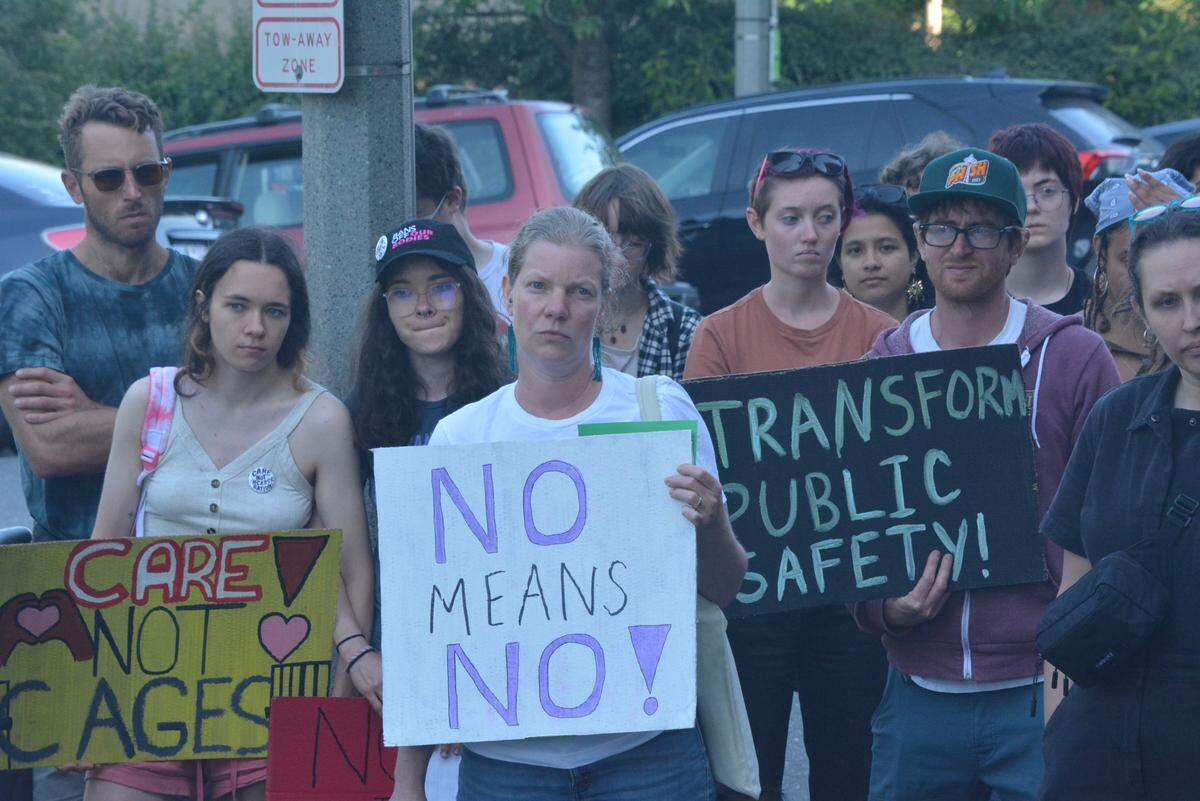 Jail opponents rally outside the Whatcom County Courthouse on July 11, as members of the County Council voted to place a jail tax on the ballot.