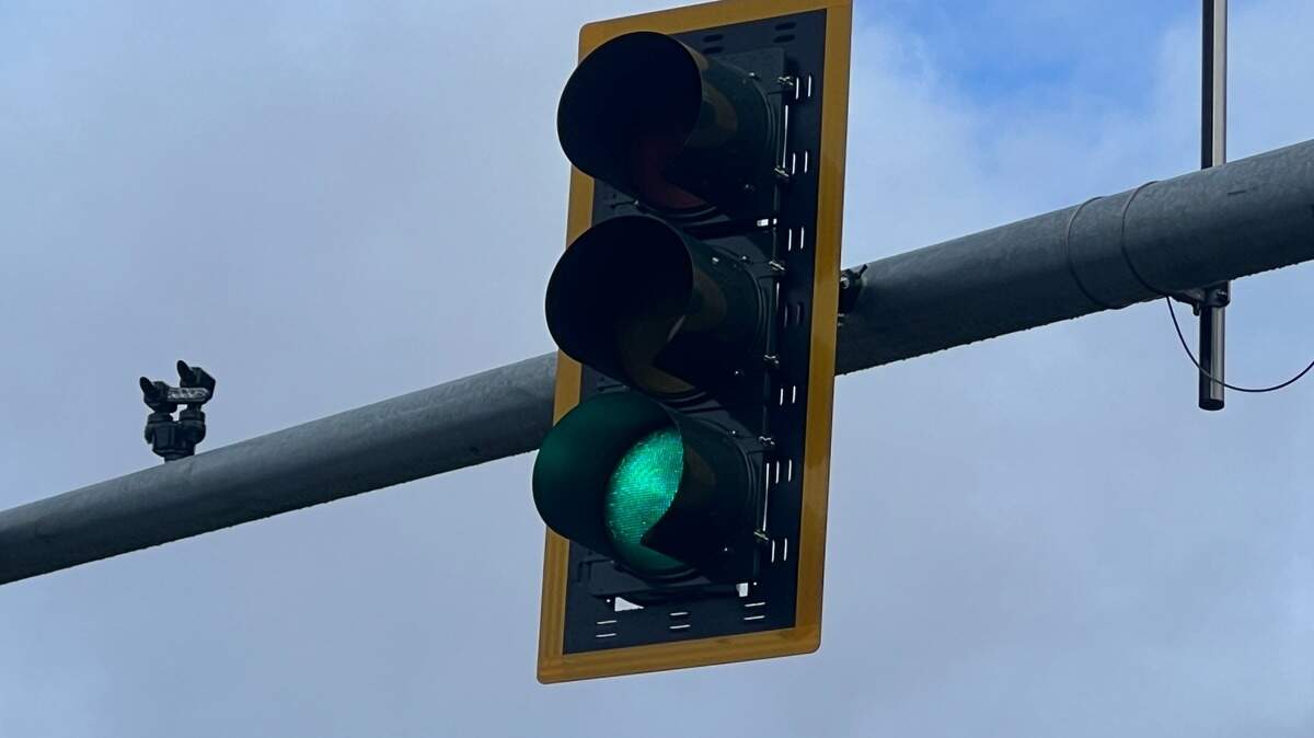 A traffic light with a green signal.