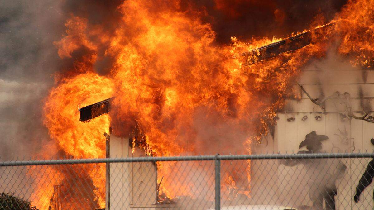 A mobile home near Bellis Fair Mall was destroyed by fire Sunday morning and a resident suffered burns to his arms and head in Bellingham. Two other units were damaged by the blaze.
