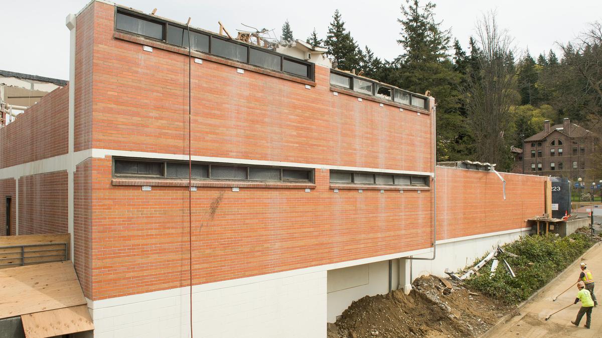 Construction crews demolish the Western bookstore to make way for the new Multicultural Center on Friday, April 20, at Western Washington University in Bellingham.