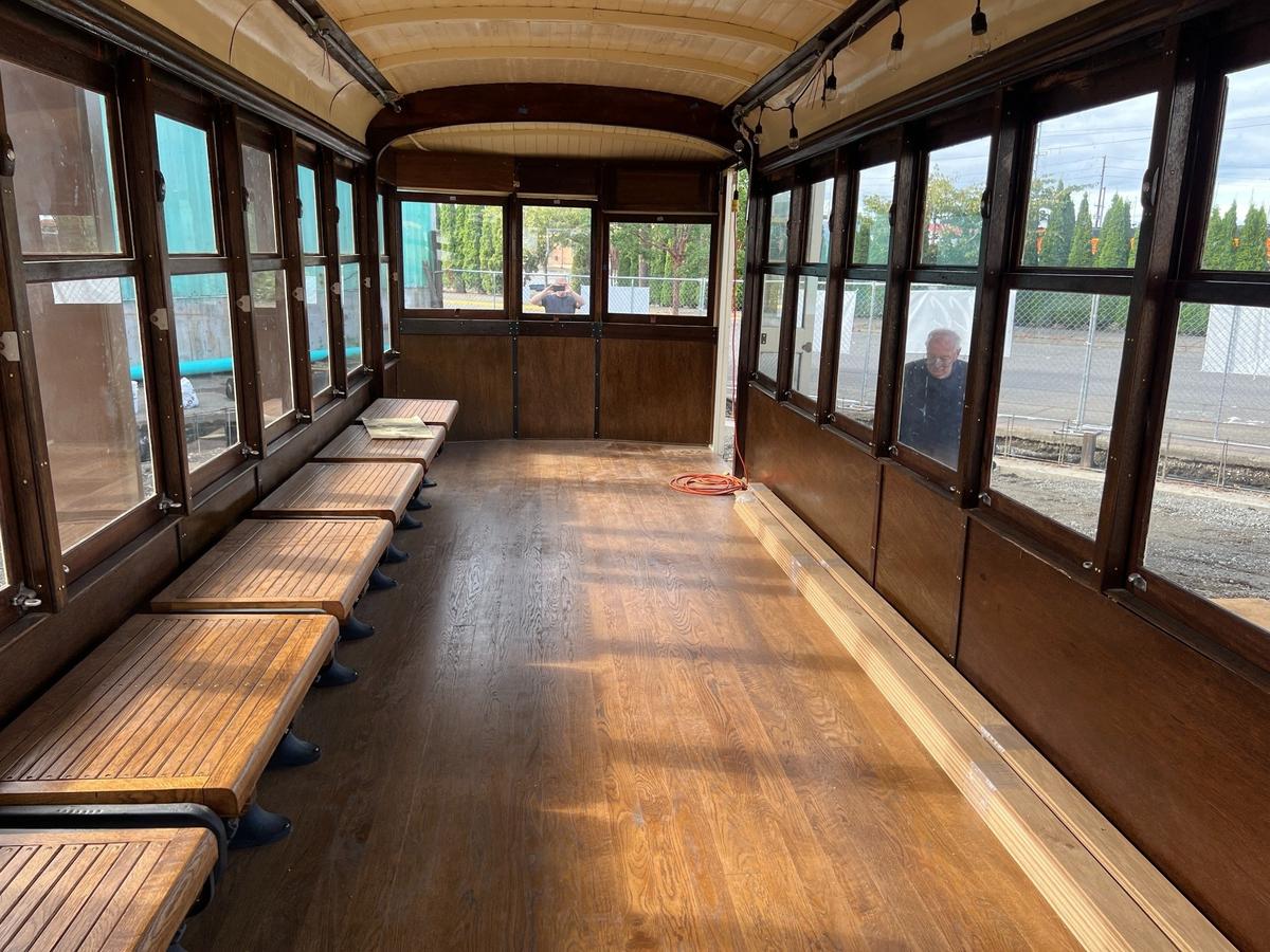The wooden interior of a restored 1924 streetcar at the corner of West Holly and E streets in the Old Town district of Bellingham, Wash., on Wednesday, July 31, 2024. The Birney Safety Car was part of a line that ran through several sections of town.
