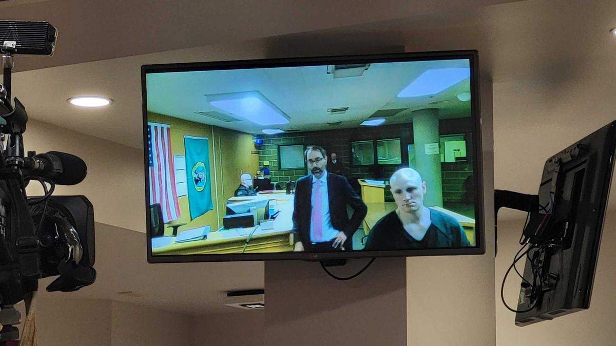 Cody Craig, right, appears by video Thursday, April 13, in Whatcom County Superior Court in Bellingham. With him is attorney Richard Larson, a public defender with the Whatcom County Public Defender’s Office. Craig, Michael Doane and Melissa Welch were booked into the Whatcom County Jail earlier April 13 on suspicion of first-degree murder in connection with the death of the 5-year-old daughter of Doane and Welch. The child died March 8 due to a “very high and fatal amount” of fentanyl in her bloodstream, according to police in Ferndale.