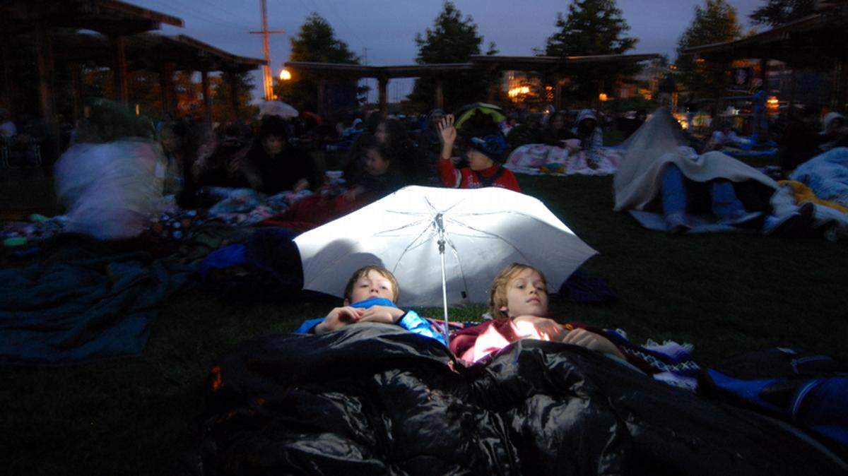 Two boys watch a screening of the “Bee Movie” at the Village Green in Fairhaven in 2008. The city of Ferndale, Pickford Film Center and Fairhaven Outdoor Cinema return to showing movies outdoors this summer across Whatcom County.