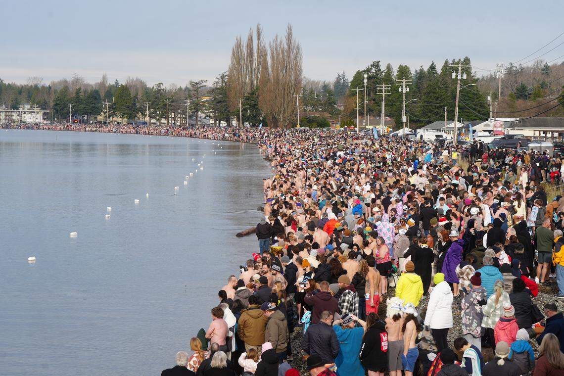 Thousands waited to attempt to break the world record for the largest polar bear dip on Jan. 1 in Birch Bay, Wash.