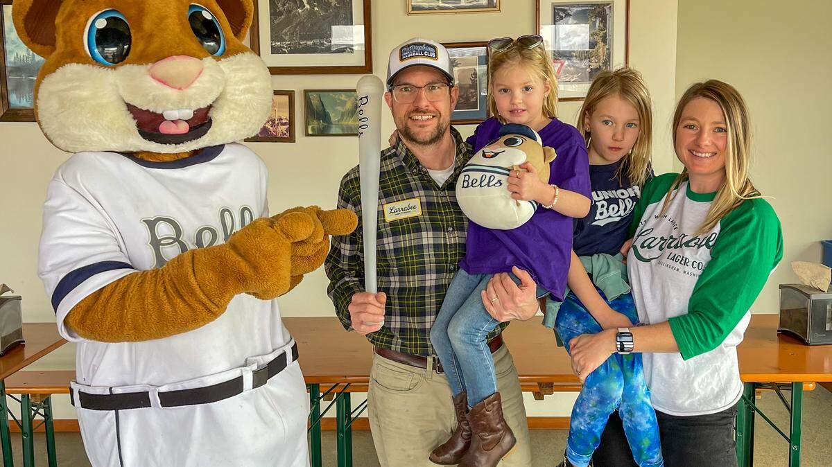 The Bellingham Bells Mascot, Dinger the Bellinghamster, with Sam and Kate Milne, owners of Larrabee Lager Company, at 4151 Guide Meridian Rd #100, Bellingham, Wash.