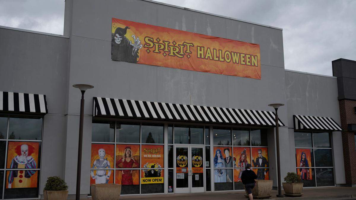 A customer walks in to the Spirit Halloween store at Bellis Fair Mall in 2021.