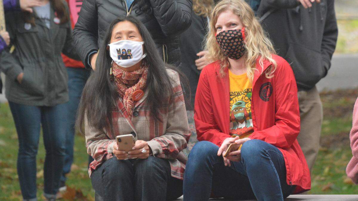 State Rep. Debra Lekanoff, left, chats with a participant in an Oct. 17, 2020, rally at City Hall in Bellingham to honor the memory of late U.S. Supreme Court Justice Ruth Bader Ginsburg. Lekanoff, who represents part of Bellingham and Whatcom County, is backing a measure to ban Native American mascots in public high schools.
