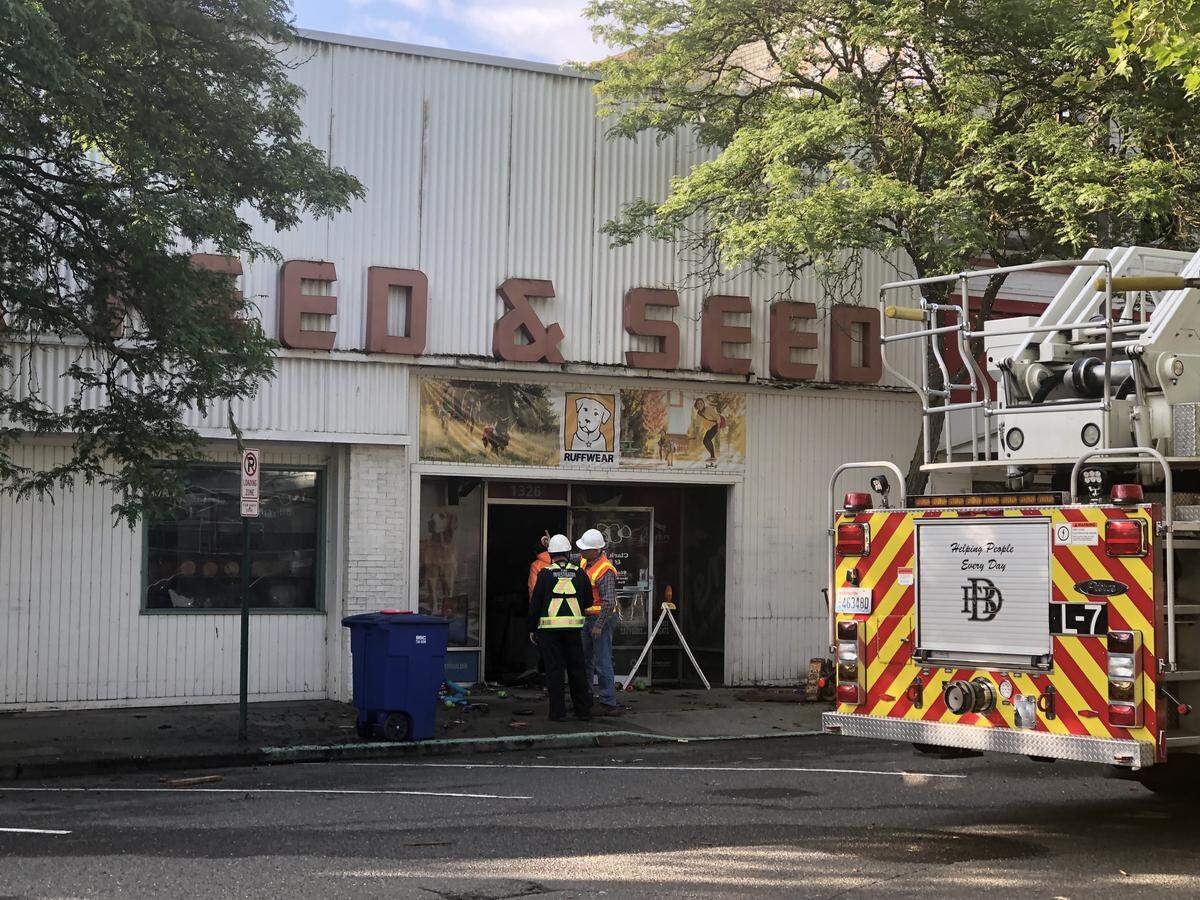Bellingham Fire crews remain downtown at the scene of the Clark Feed & Seed and Avalon Records fire earlier this week in Bellingham.