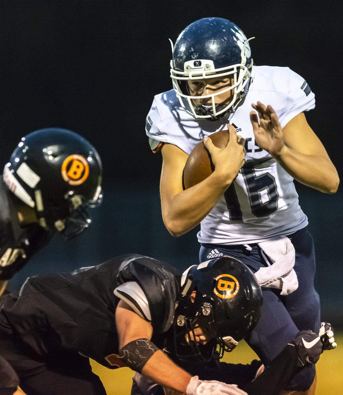 Lynden Christian quarterback Trajan Schouten looks to evade the Blaine defensive line on Sept. 14. Strength and team building forged in the Lynden Christian weight room helped propel the Lyncs to a share of their first 1A NWC title since 2001 and a Northwest District playoff date with King’s on Friday.