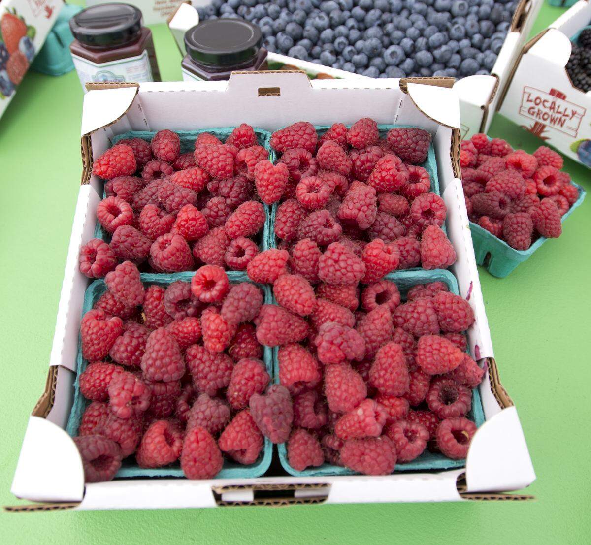 Raspberries and blueberries from Barbies Berries at the 2014 Northwest Raspberry Festival. As Whatcom County berry farmers start gearing up for the harvest season, many are already bracing for a double-whammy of problems: