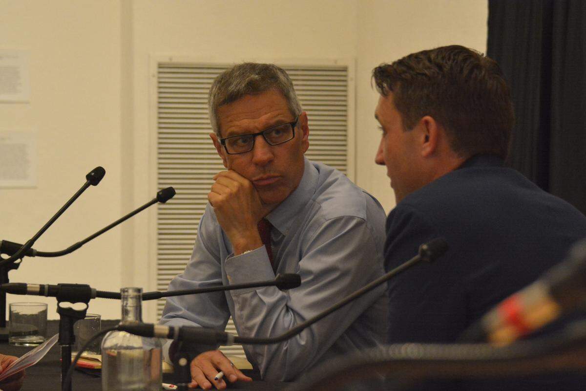 Bellingham lawyer Seth Fleetwood, left, and home builder Garrett O’Brien, who are running for Bellingham mayor, chat after a June 19 candidate forum sponsored by the Downtown Bellingham Partnership at the Whatcom Museum.