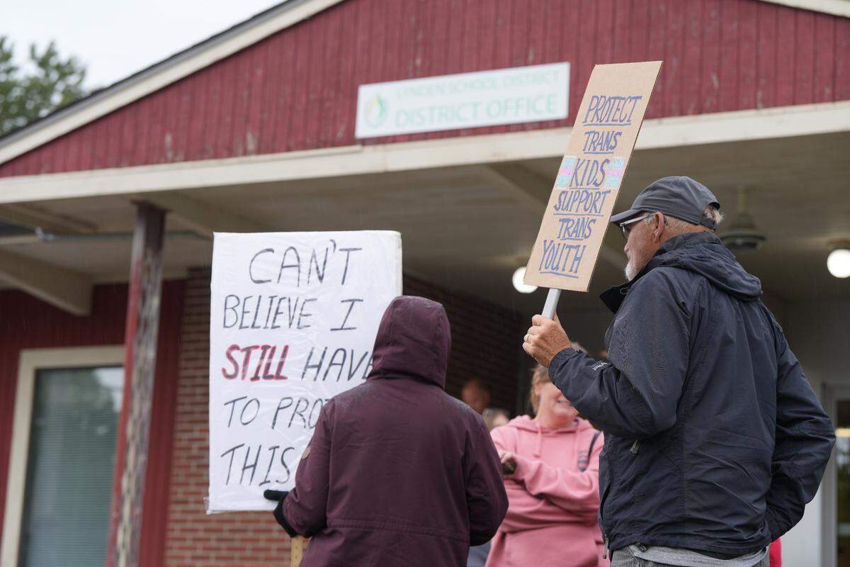 Demonstrators gathered outside the Lynden Public Schools District Board meeting on Thursday, May 15, 2025, in Lynden to oppose the board’s resolution regarding concerns over transgender students participating in girls sports.