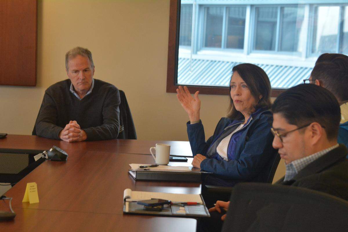 Rob Fix, left, executive director of the Port of Bellingham, meets with U.S. Sen. Maria Cantwell, D-Wash., center, during a tour of port facilities on Wednesday, Oct. 23, 2024, in Bellingham, Wash.