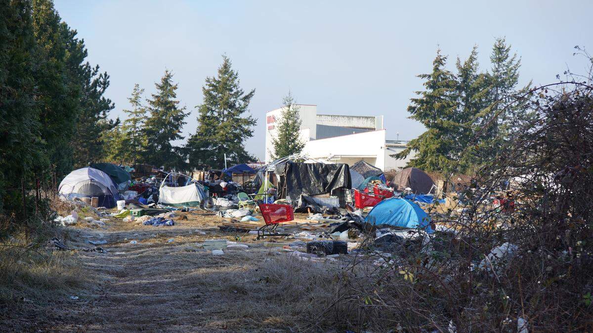 Tents and temporary shelters occupy the property at 4049 Deemer Road near WinCo Foods in 2022 in Bellingham.