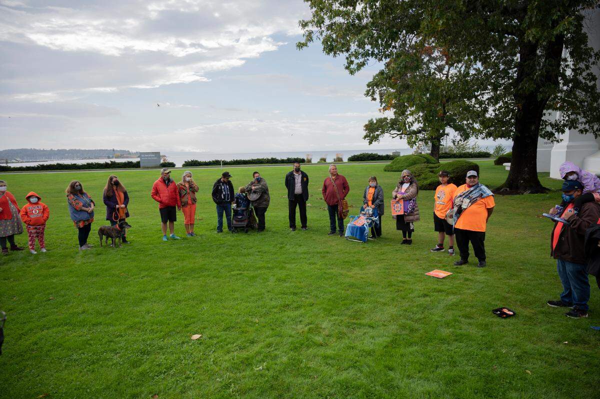 People from the Lummi Nation, Nooksack Tribe and other Indigenous people gathered for the ceremony at Peace Arch Park on Thursday, Sept. 30, to acknowledge Native children who died in residential schools, including the 215 children who were found buried at the site of the former Kamloops Indian Residential School in British Columbia.
