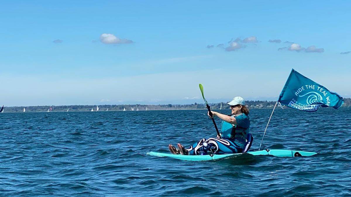Kari Neumeyer paddles during the 2022 Ride the Teal Wave fundraiser for ovarian cancer research. The event returns for its third year on Saturday, Sept. 7.