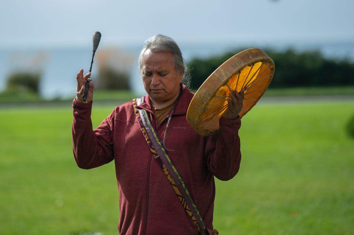 Michael Howling Wolf, of Medean Hidatsa, Arikara ancestry, concludes a prayer Thursday, Sept. 30, at Peace Arch Park in Blaine. He spoke during a ceremony to acknowledge Native children who died in residential schools, including the 215 children who were found buried at the site of the former Kamloops Indian Residential School in British Colombia in May 2021.