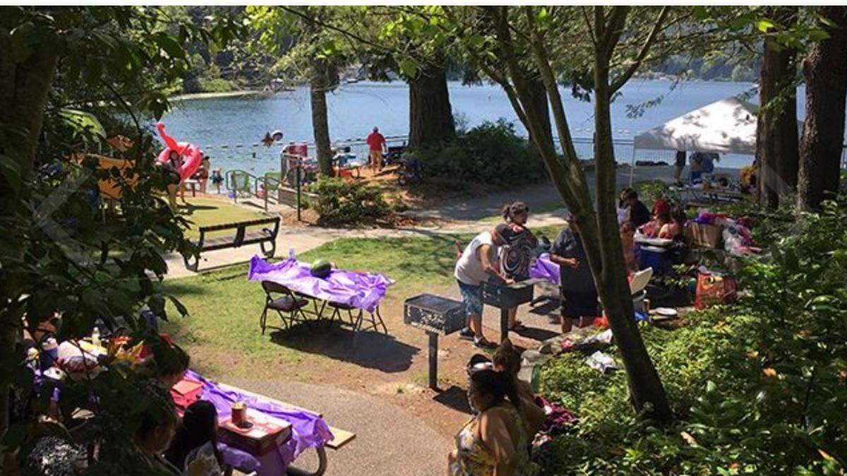 People picnic at Samish Park in southern Whatcom County in an undated handout photo. The park will close for 15 months to replace a bridge across the lake.