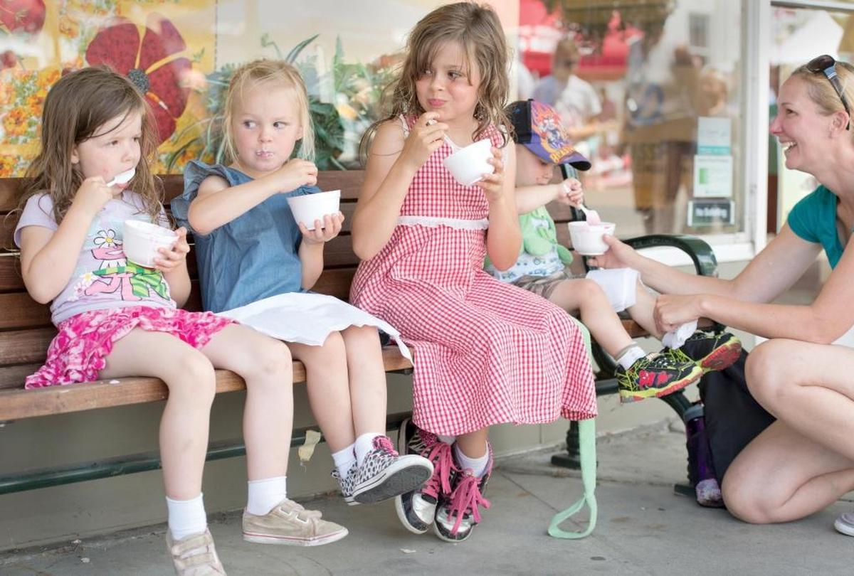 From left: Tilly May, 4, Carrington Balback, 4, Ruby May, 8, Wesley Balback, 2, and Ayn Balback try the raspberry sundaes in July 2014 at the The Northwest Raspberry Festival in downtown Lynden.